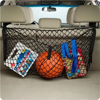 Image showing product in black netting installed in a vehicle with various items stored inside.