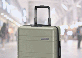 Gif of different luggage changing, soft shell black blue, soft shell grey and hard shell beige, with people busily walking around. 