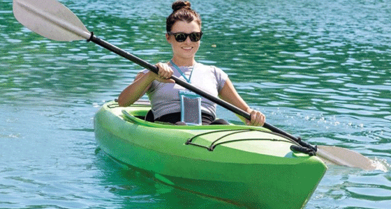 Gif of a woman kayaking and smiling, man sitting in a parked classic car turned sideways enjoying the view of nature, and a mother and a son walking towards to a boat.