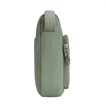 Travelon Roam Anti-theft Crossbody: Lightweight moss green nylon with handle, side pocket, and anti-theft zipper detail.