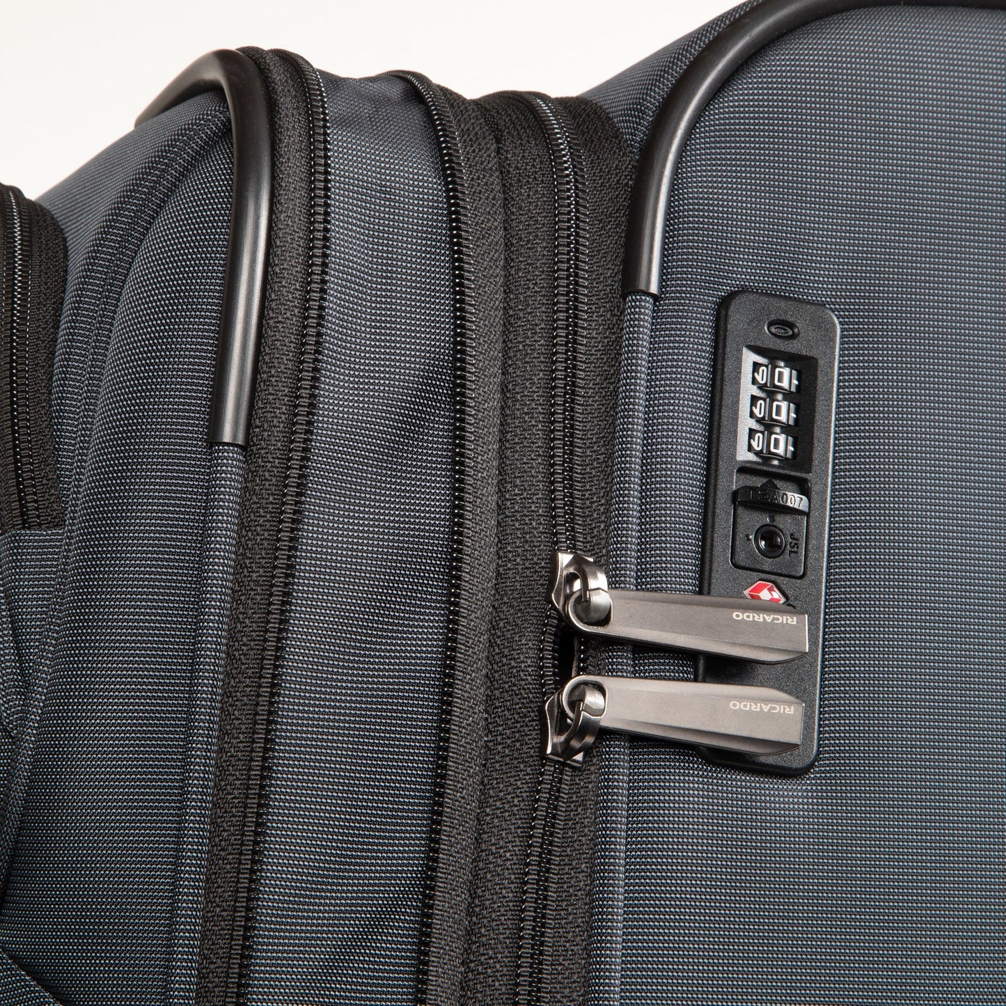 Close-up of the Ricardo Beverly Hills Montecito 3.0 Softside Carry-on with dual zippers and TSA combo lock.