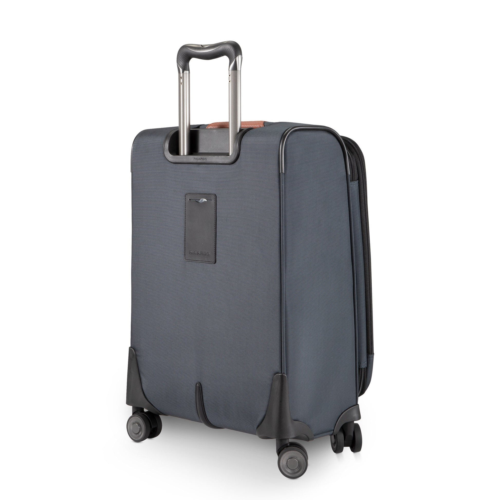 The Ricardo Beverly Hills Montecito 3.0 gray softside carry-on spinner stands upright with four wheels and an extended handle.