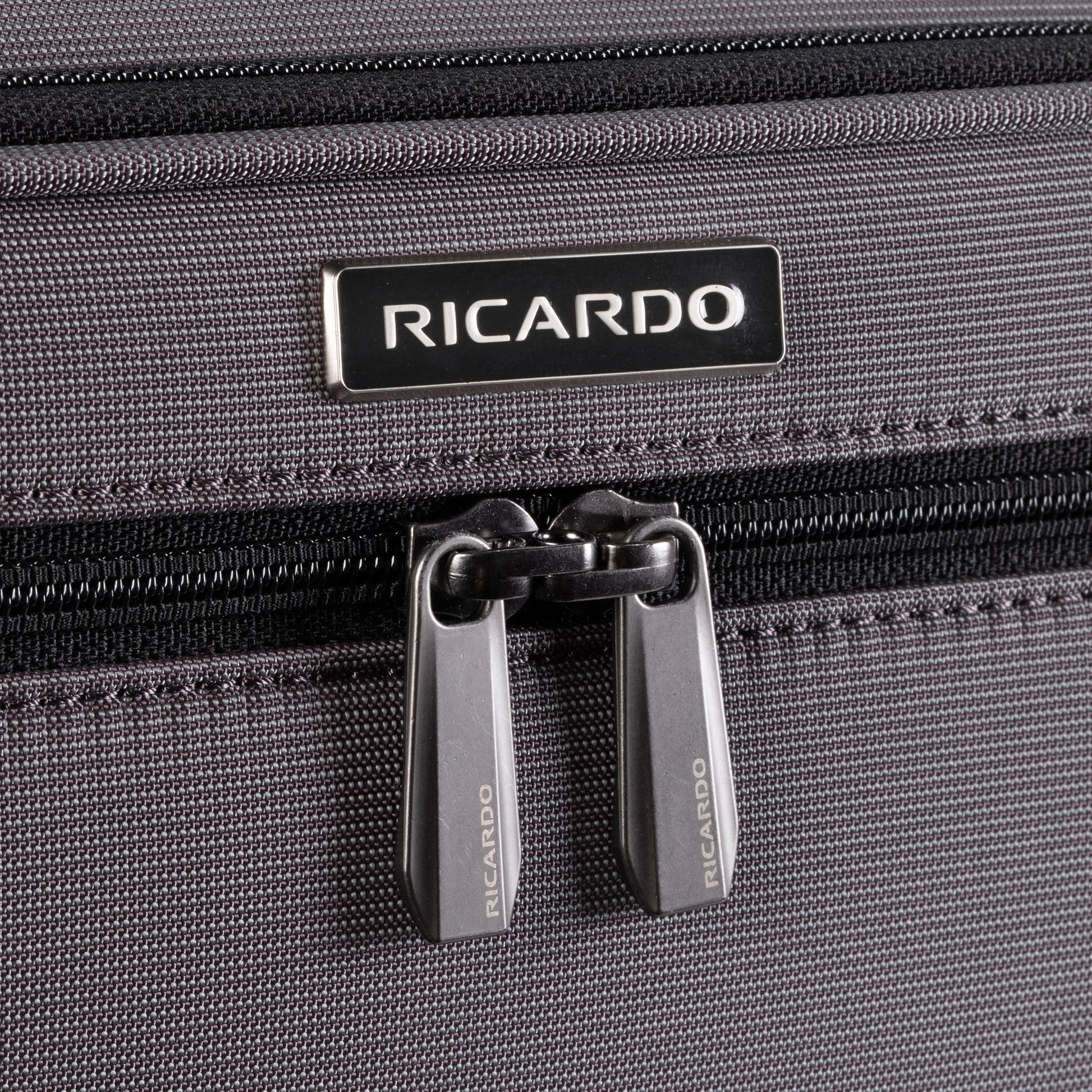 Close-up of the Ricardo Beverly Hills Montecito 3.0 medium softside spinner with dual zipper pulls.