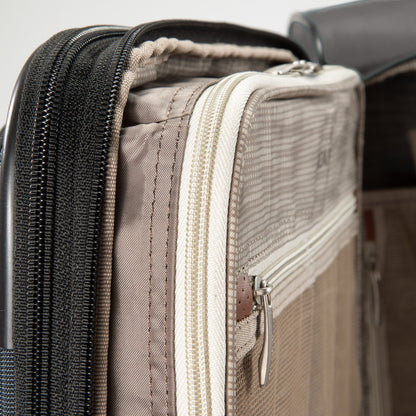 Close-up of zippered compartments on the Ricardo Beverly Hills Montecito 3.0 Softside Medium Spinner.