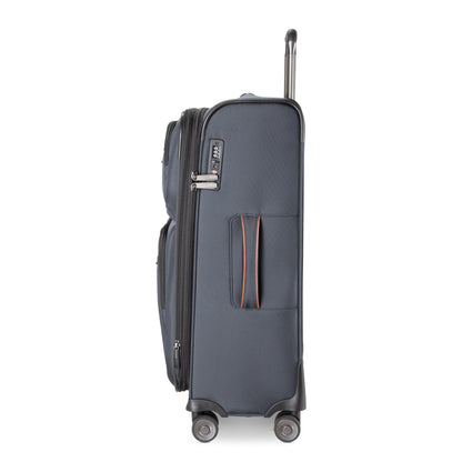 Ricardo Beverly Hills Montecito 3.0 medium navy softside luggage shown sideways with handle up, two zips visible.