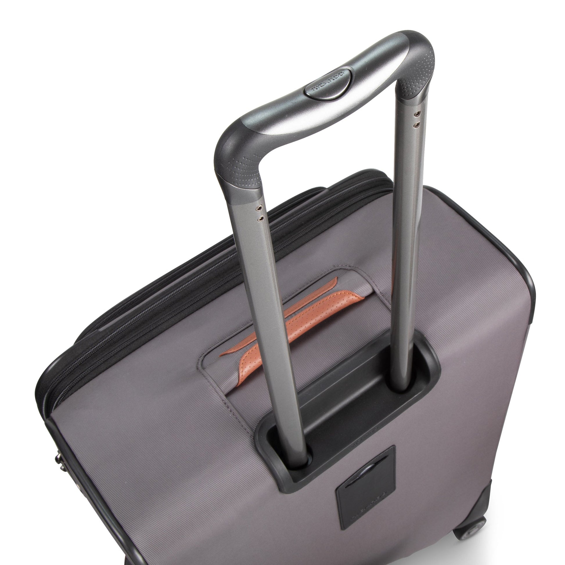 Ricardo Beverly Hills Montecito 3.0 large gray spinner has a telescopic handle and brown leather trim by the zipper.