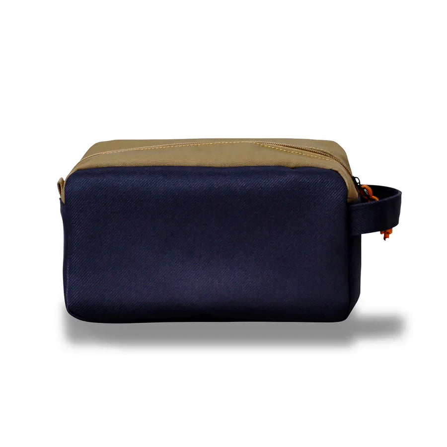 Northern Icons Canada Travel Toiletry Bag: tan top, navy sides, side handle; shown on white background.