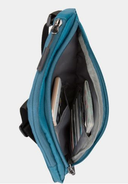 Unzip the Travelon World Travel Essentials Slim Crossbody Bag in blue to reveal your travel essentials: a smartphone, wallet, and neatly organized papers inside.