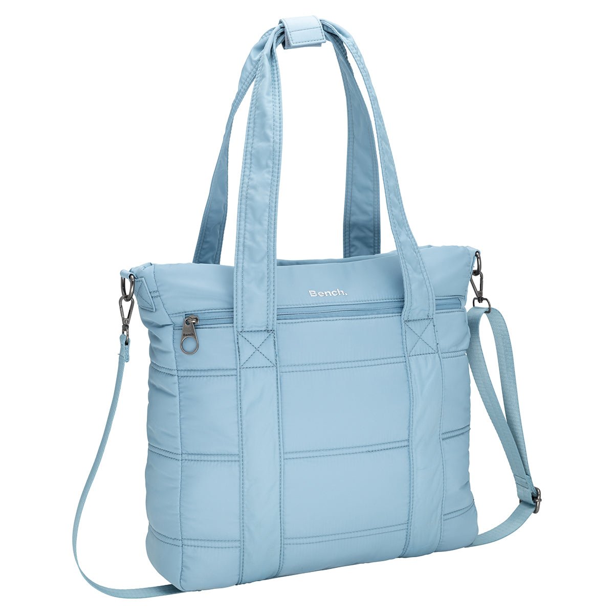 Bench Georgia Satchel in light blue with quilted design, two handles, front zip pocket, and detachable strap.