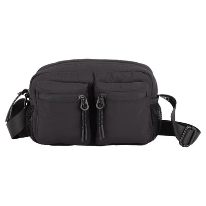 Bench Nylon Crossbody: A compact nylon bag with two zip pockets, mesh sides, and adjustable strap—ideal for daily use.