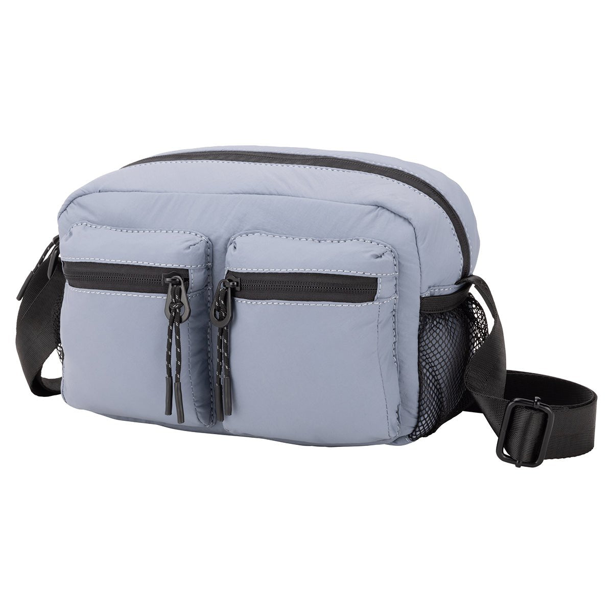 Bench Nylon Crossbody: Light blue bag with two zip pockets, mesh side pocket, and adjustable black strap.