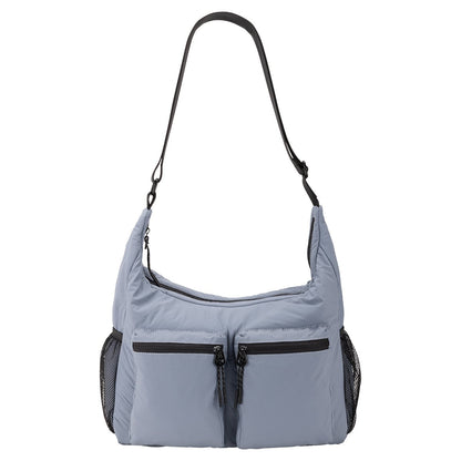 Bench Nylon Hobo Bag in blue with two zip pockets, mesh sides, and adjustable shoulder strap.