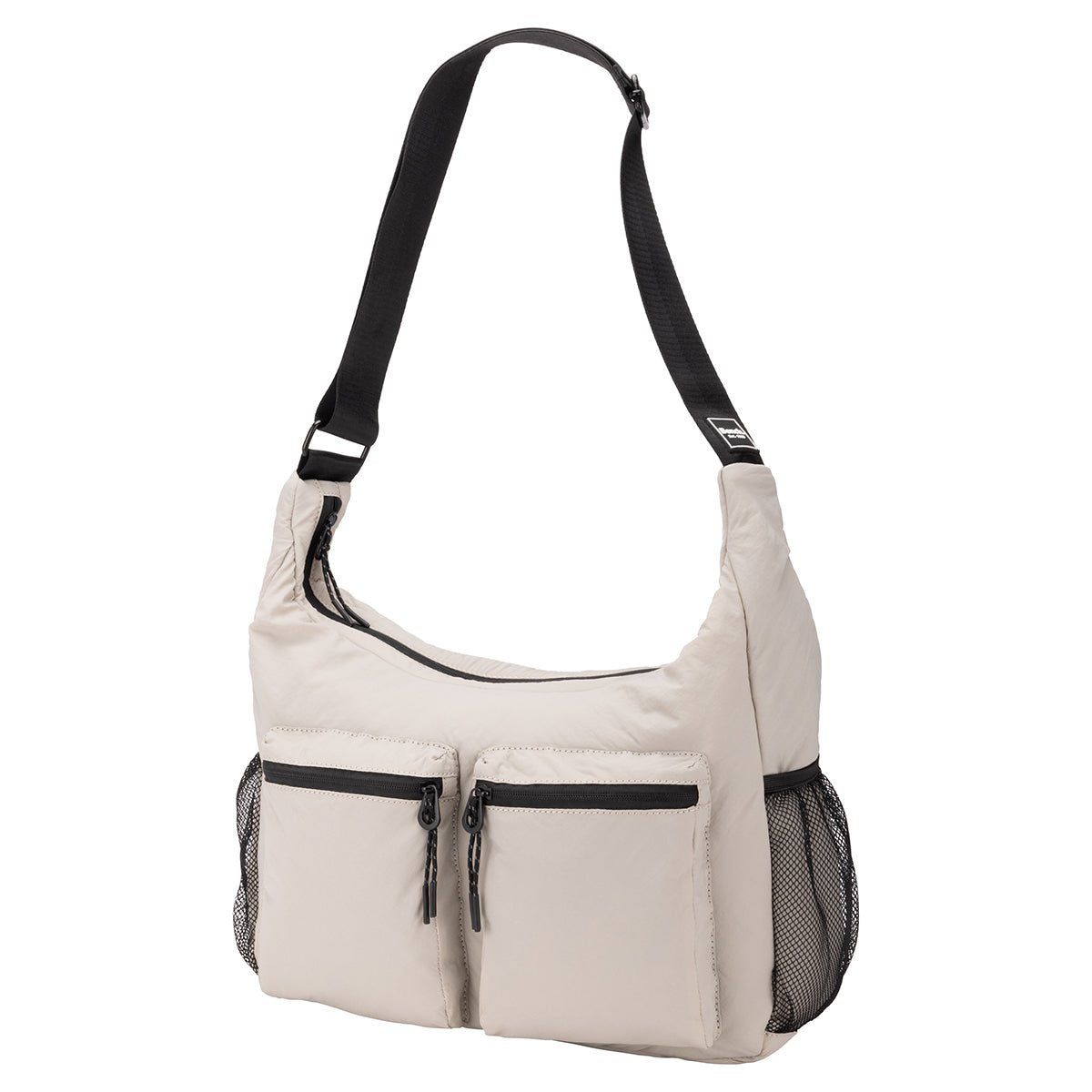 Bench Nylon Hobo Bag in beige with black adjustable strap, two front zip pockets, and mesh side pockets.