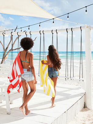 Women carrying towel on beach - See All Travel Accessories products