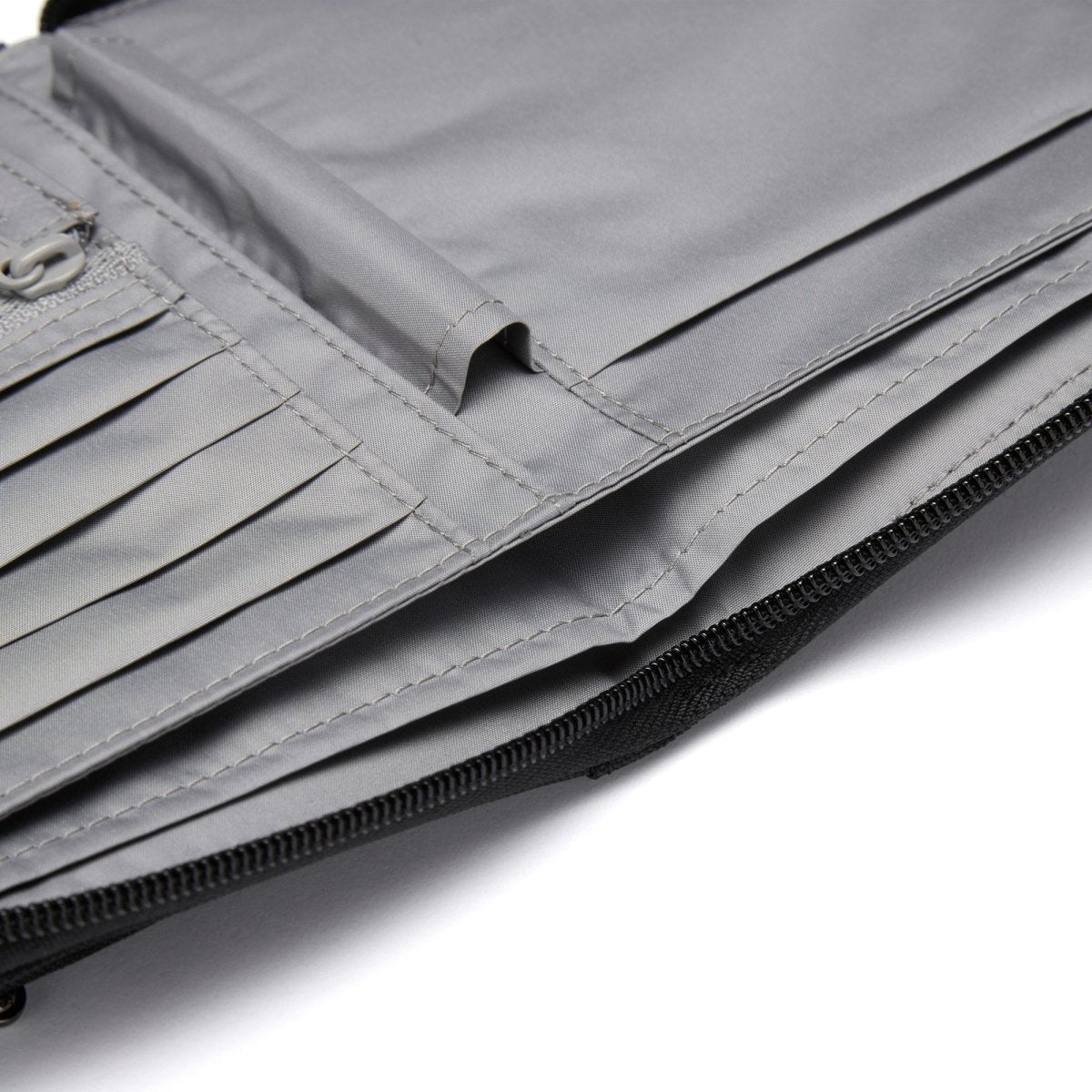 Close-up of Pacsafe® RFIDsafe™ Travel Organizer with RFID blocking, card slots, and a zipper compartment.