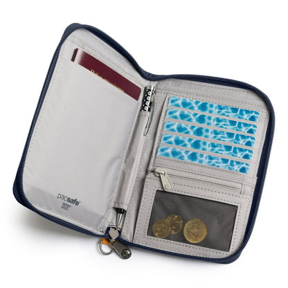 The Pacsafe® RFIDsafe™ organizer, made of recycled polyester, holds a passport, pen, cards, and coins in a mesh pocket.