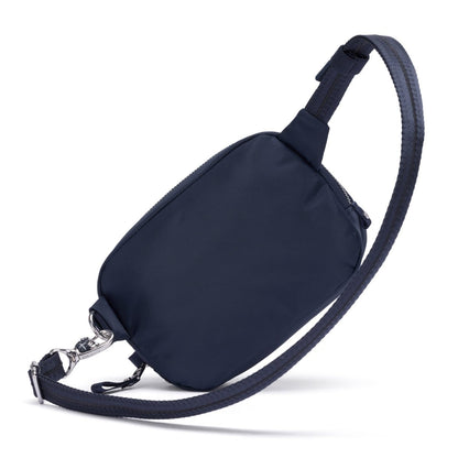 Pacsafe® W Anti-theft Micro Sling in navy blue with RFID blocking, adjustable strap, and silver hardware.