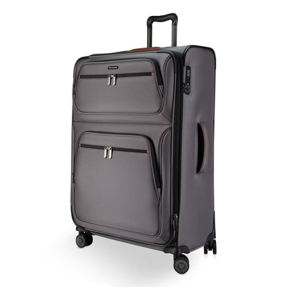 Ricardo Beverly Hills Montecito 3.0 large gray expandable spinner with two front zip pockets, on white background.