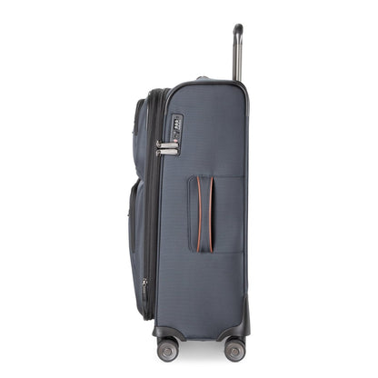 Ricardo Beverly Hills Montecito 3.0 medium navy softside luggage shown sideways with handle up, two zips visible.