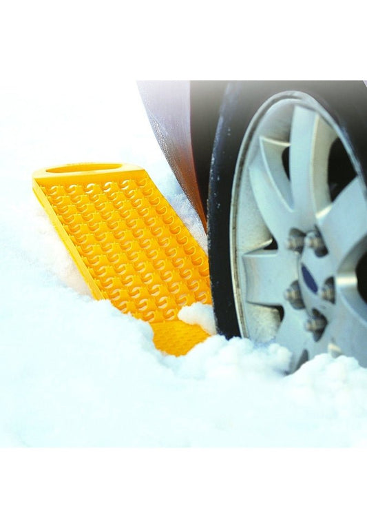 Product Image – Image showing closeup of tire in thick snow with product molded in yellow sticking out from rear of tire.