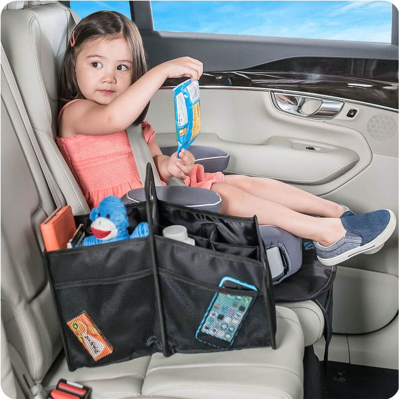 Image showing a young girl strapped into a car seat with the product in black on the seat next to her.