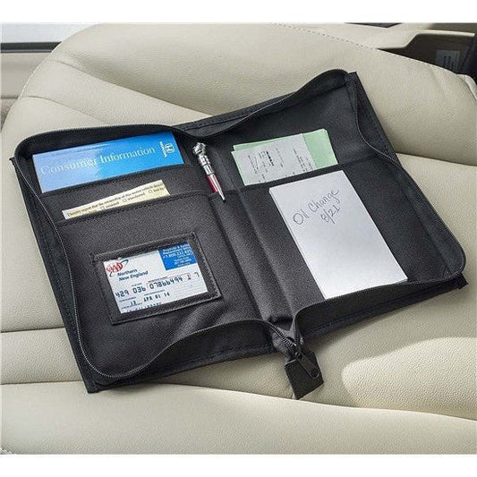 Product Image – Image showing product in black open on a car seat with various pieces of id and notes.