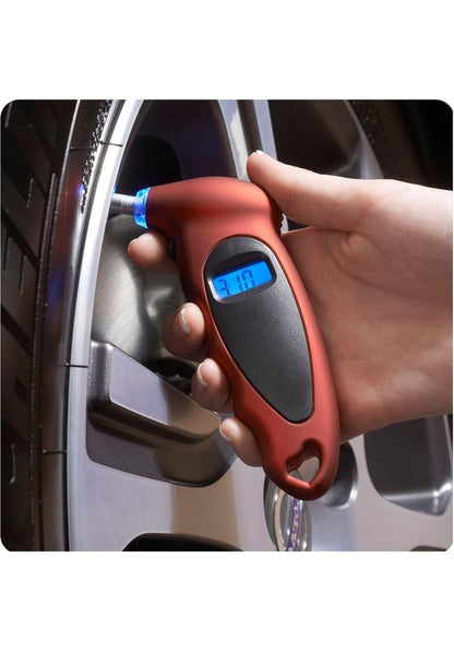 Image showing a hand holding the product in red colour and testing the pressure on a tire.