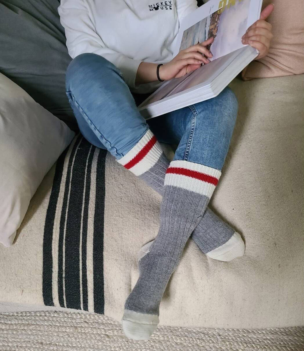 Person sitting on a couch in jb fields casual traditional wool boot socks