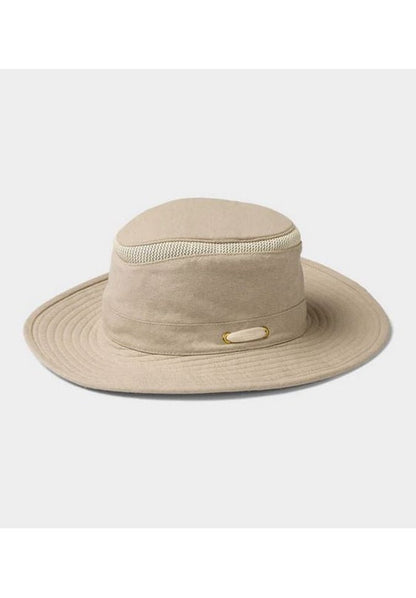 Sand-colored wide-brim Tilley TMH55 Mash-Up Airflo® hat with UPF 50+ sun protective fabric, featuring a mesh ventilation band and an oval accent on the side, set against a plain background.