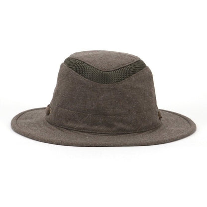 The Tilley TMH55 Mash-Up Airflo® - Clearance is a brown wide-brimmed hat from Tilley, featuring a green ventilation mesh band around the crown. It offers sun-protective fabric with UPF 50+ for your outdoor adventures.