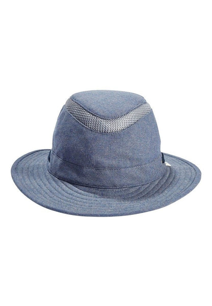 Introducing the Tilley TMH55 Mash-Up Airflo® in denim, a stylish sun hat that boasts UPF 50+ sun protective fabric. It features a wide brim and is accented with a light gray ventilation mesh band around the crown, elegantly presented on a plain white background.