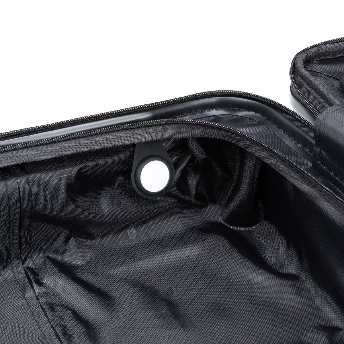 Open Travelite black spinner with tracker holder inside; made from lightweight polycarbonate.