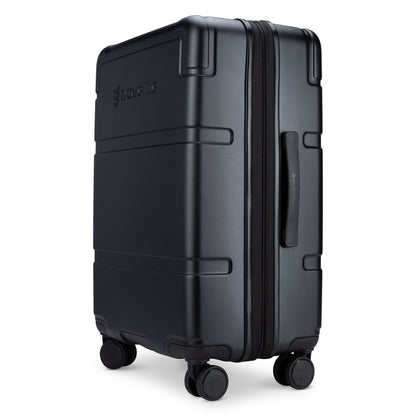 Travelite Itinerary Medium Spinner in black, features eight 360° wheels and stands upright stylishly.
