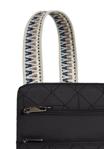 The Travelon Boho Anti-Theft Slim Crossbody is a stylish black quilted bag featuring two woven handles with a blue and beige pattern and a zipper pocket. This crossbody bag offers not only style but also security with its RFID blocking organizer, ensuring your essentials are safe.