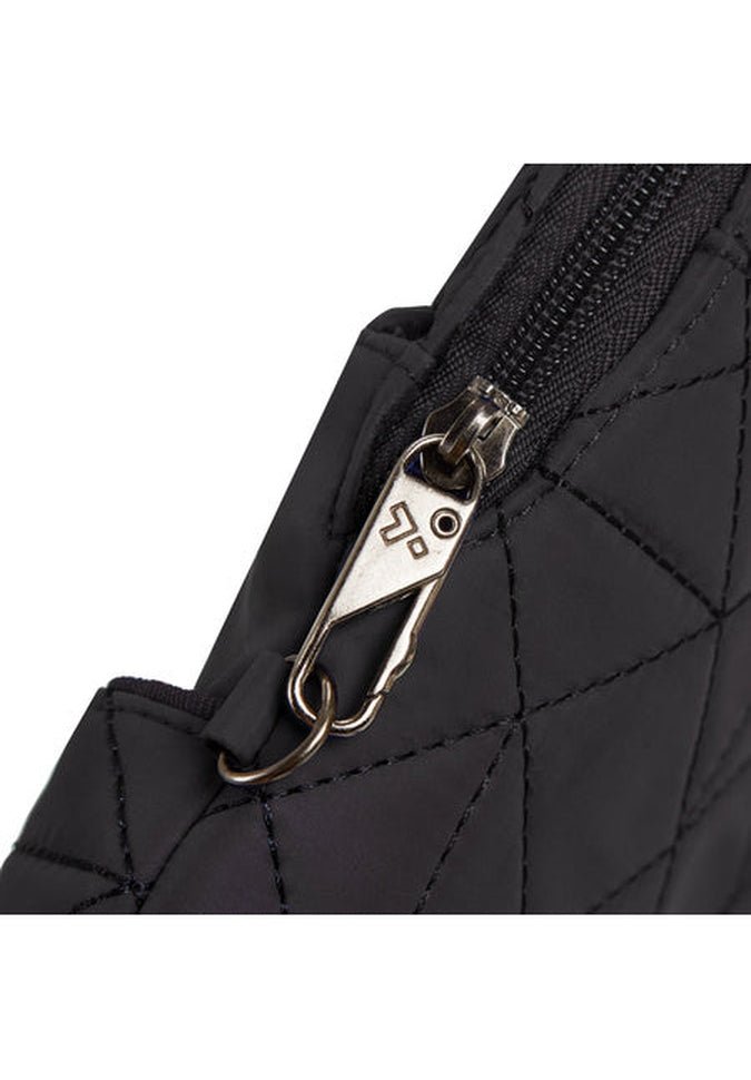 Close-up of the Travelon Boho Anti-Theft Slim Crossbody bag, showcasing a black quilted fabric design with a silver zipper pull and black zipper, and featuring advanced security elements for added peace of mind.