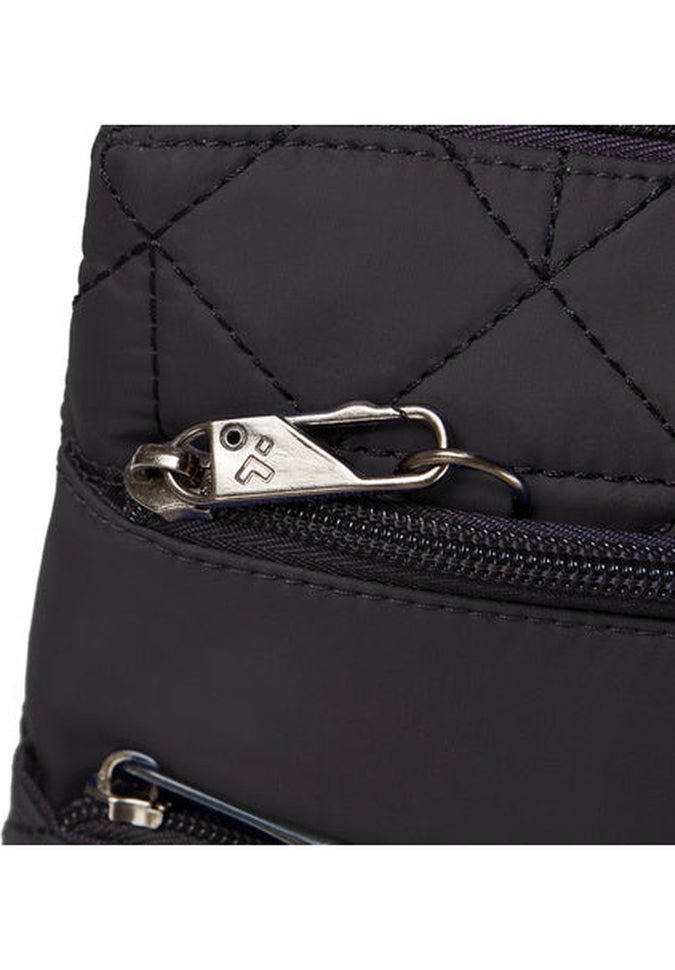 Close-up of a black quilted fabric with a metal zipper, showcasing the Travelon Boho Anti-Theft Slim Crossbody design.