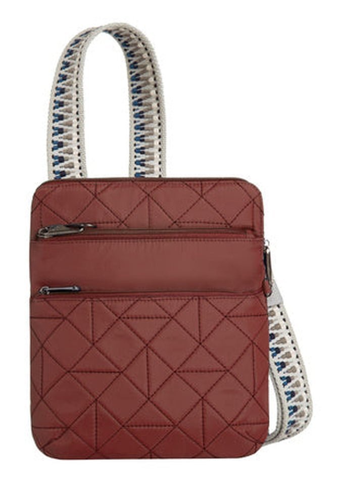 The Travelon Boho Anti-Theft Slim Crossbody is a quilted red shoulder bag with two zippered pockets and a patterned strap, offering RFID blocking for enhanced security. It seamlessly combines boho style with anti-theft features.