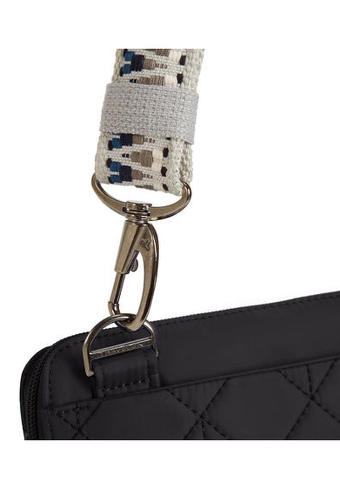 Close-up of the Travelon Boho Anti-Theft Slim Crossbody in quilted black, featuring a stylish patterned fabric strap in Boho style, securely attached by a metal clasp.