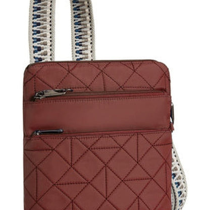 The Travelon Boho Anti-Theft Slim Crossbody, by Travelon, is a paprika quilted shoulder bag adorned with a geometric pattern. It comes with an RFID blocking organizer and two front zippers, and features a white strap accented with blue details, offering both style and security.