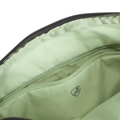Open green interior of Travelon Roam Anti-theft Crossbody with a zip pocket and small logo in lightweight nylon.