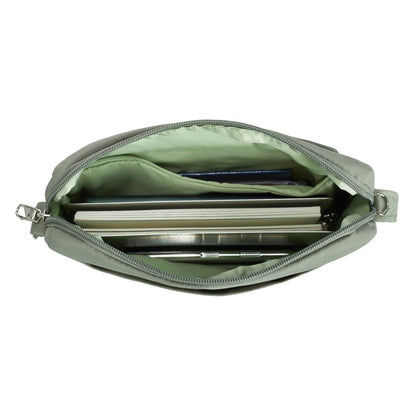 Inside view of moss Travelon Roam Anti-theft East/West Crossbody with books and phone inside.