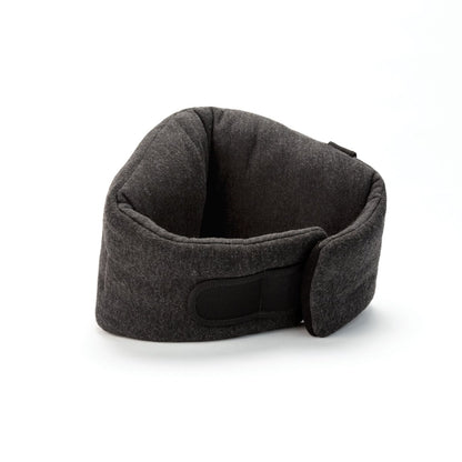 The Travelon SOMNiWRAP Travel Pillow, featuring a gray ergonomic wraparound design and a black Velcro strap, provides excellent neck support and is displayed on a white background.