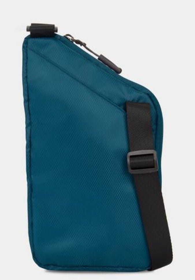 The Travelon World Travel Essentials Slim Crossbody Bag, ideal for carrying travel necessities, is equipped with a black adjustable strap and offers RFID protection. It features a zipper closure against a minimalist design.