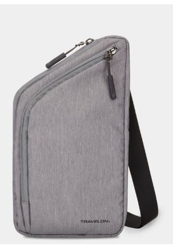 This Travelon World Travel Essentials Slim Crossbody Bag in gray is designed with a curved zipper pocket and an adjustable black strap, featuring the "Travelon" brand name at the bottom. Enjoy peace of mind on your travels with its RFID-protected design.