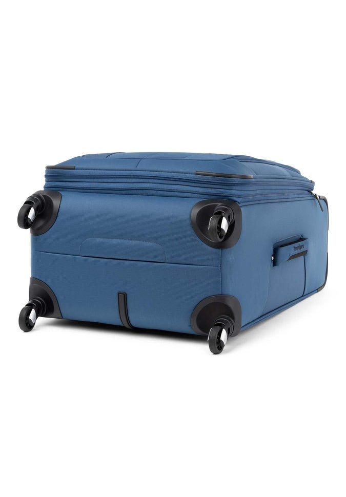 A Travelpro® Maxlite® 5 25" Expandable Spinner suitcase in blue rests on its back, showcasing lightweight 360° spinner wheels and a practical side handle.