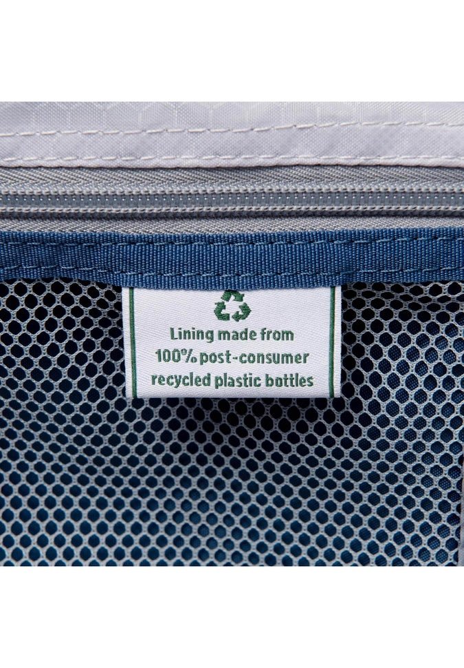 Close-up of a label on a blue mesh bag attached to the Travelpro® Maxlite® 5 25" Expandable Spinner by Travelpro, displaying the text: "Lining made from 100% post-consumer recycled plastic bottles" with a recycling icon above.