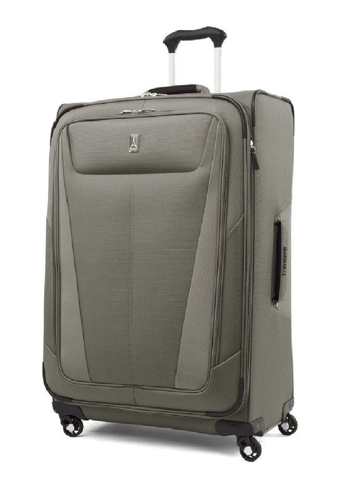 Image showing olive coloured luggage piece with silver and black carrying handle extended.