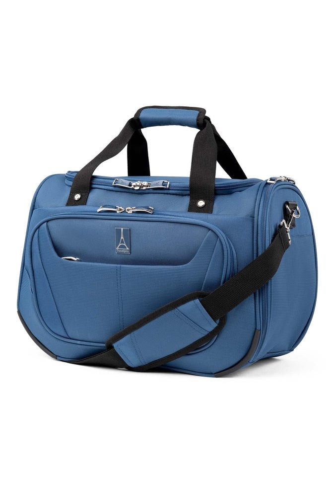 A large Maxlite 5 Soft Tote travel bag by Travelpro in Ensign Blue, featuring multiple compartments, black handles, and a detachable shoulder strap.