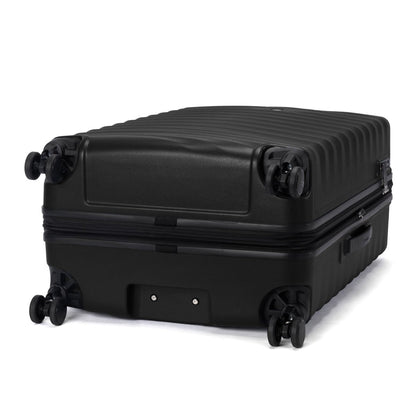 The Travelpro Maxlite Air V2 Large Hardside Spinner displays four wheels and a ribbed surface.