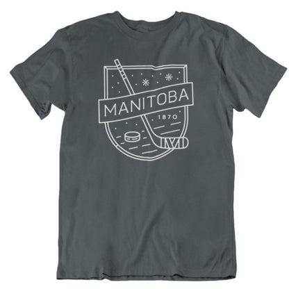 Charcoal T-shirt designed for the puck lover's wardrobe, featuring a hockey stick, puck, and the text "MANITOBA 1870" in white—an essential addition for any MB Hockey tee collection from We Heart Winnipeg. Introducing the We Heart Winnipeg MB Hockey T-Shirt.